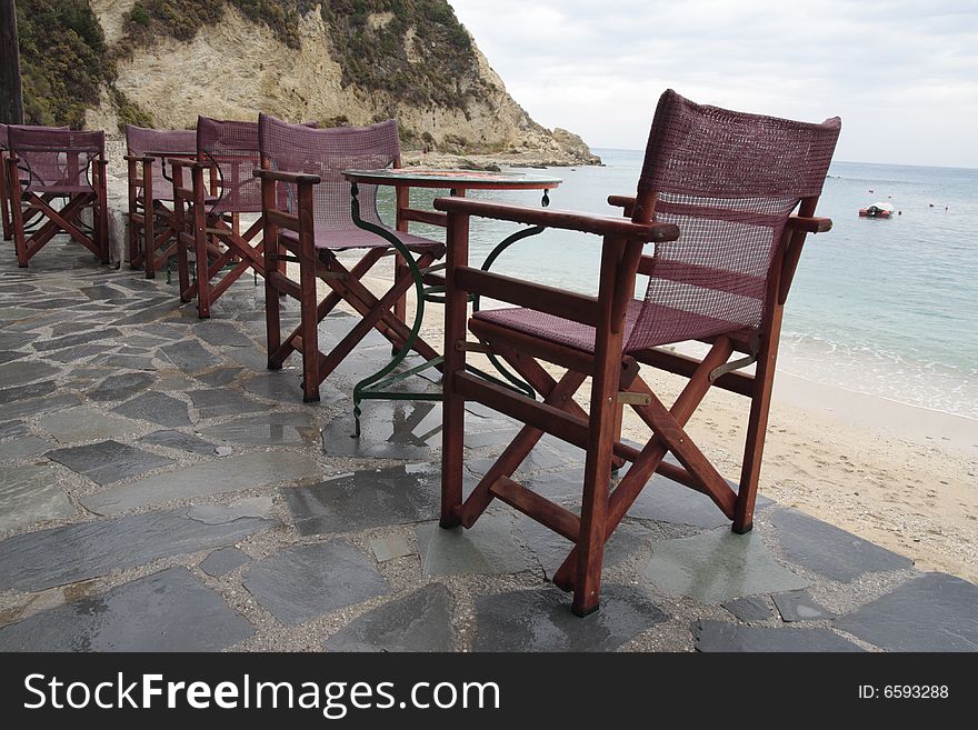 The furniture of the beach cafe in rain.