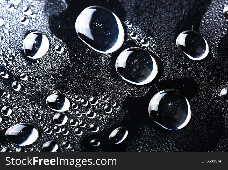 Some water drops on black background