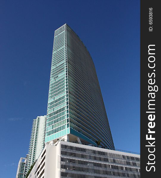 Modern architectural building on a deep blue sky. Modern architectural building on a deep blue sky