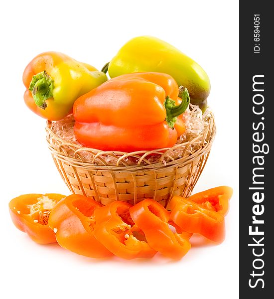 Red green yellow sweet beautiful pepper in basket on white background. Red green yellow sweet beautiful pepper in basket on white background