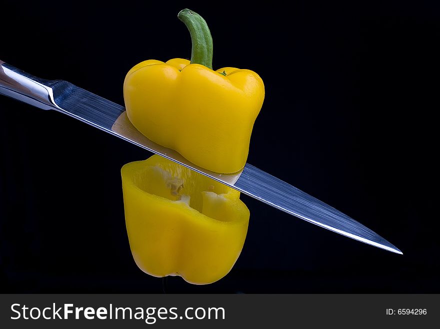 Pepper cut into two sections with a knife