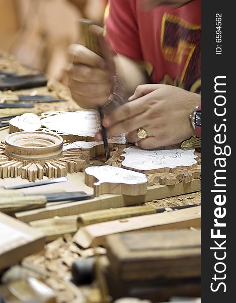 Detail of a craftsman of the wood working on a piece