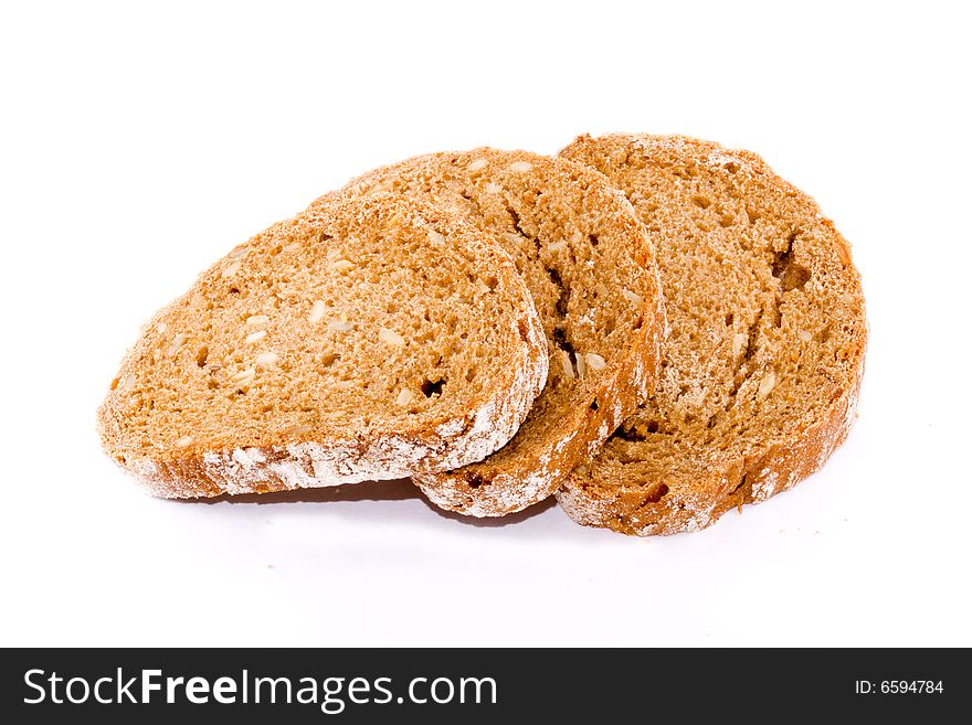 Three slices of whole bread on the white background