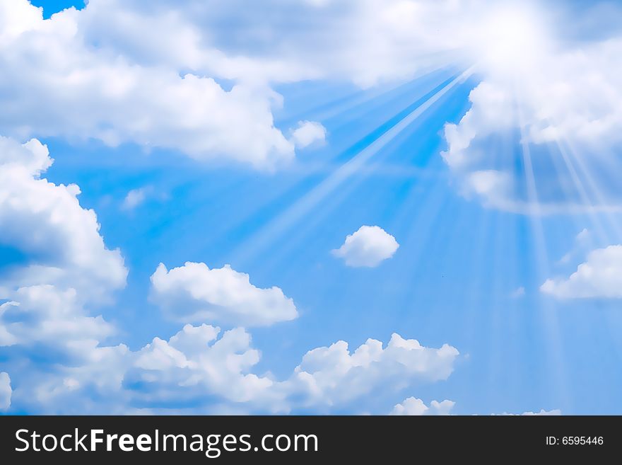 Bright sunbeams illuminate beautiful cloud on blue sky