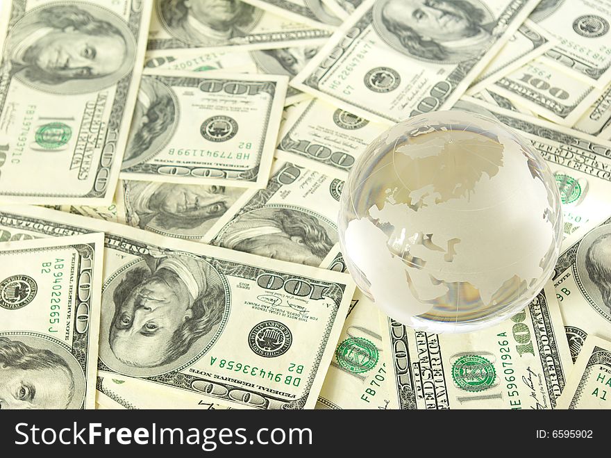 Globe isolated on a dollars background. Globe isolated on a dollars background