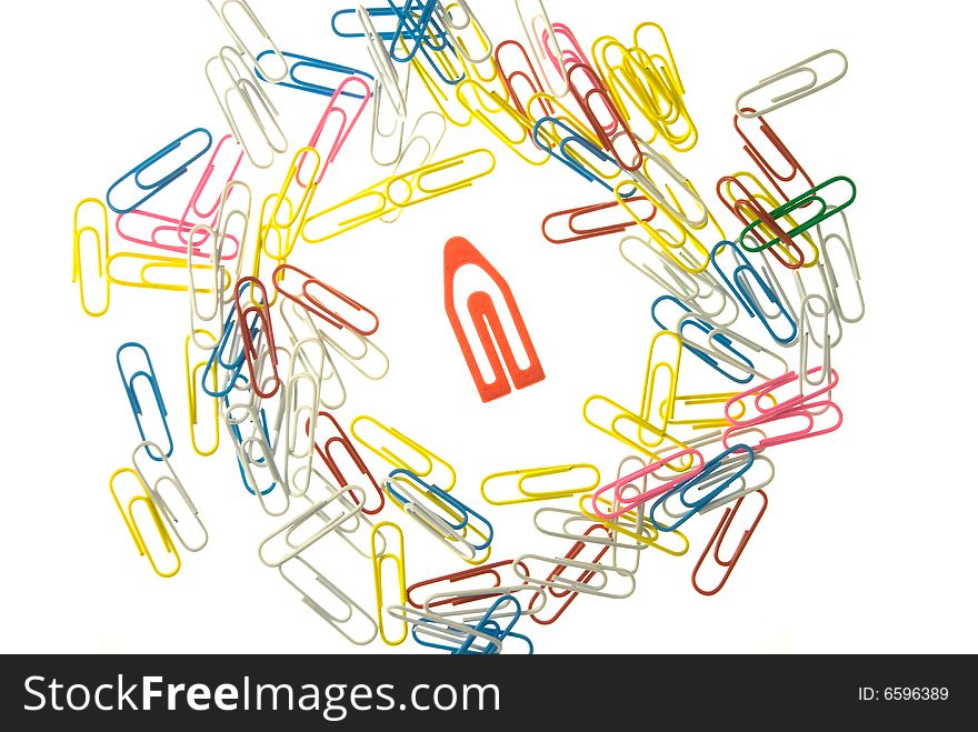 Big, red paperclip in a group of small paperclips