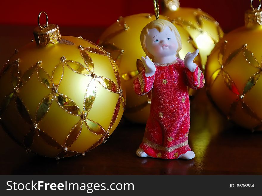 Close-up of glass balls and a clay angel. Close-up of glass balls and a clay angel