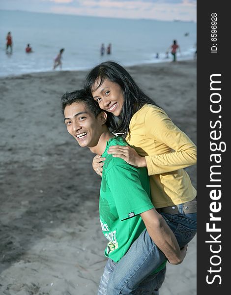 Couple fun on beach at evening. Couple fun on beach at evening