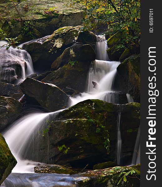 Mountain stream and small waterfalls on a nature trail