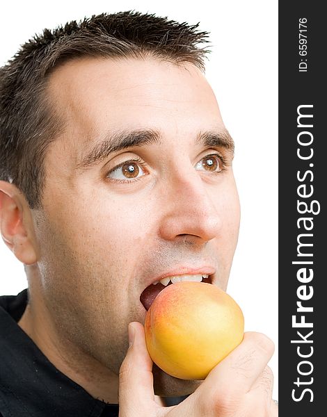 Young man Eating a peach