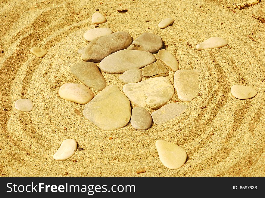 Stones on sea sand, a background. Stones on sea sand, a background