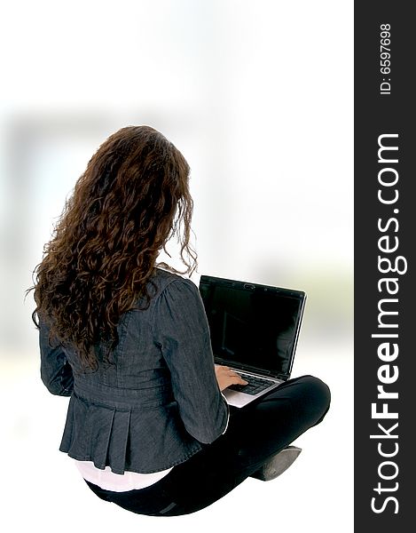 Female busy with laptop on an abstract  background