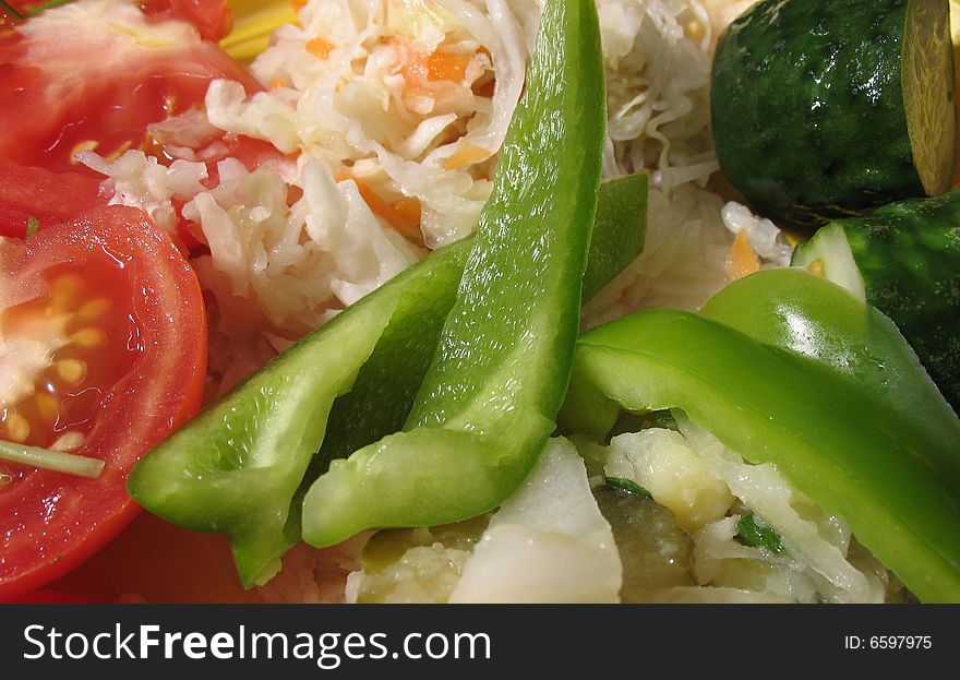 A salad from fresh, tasty, many-coloured vegetables. A salad from fresh, tasty, many-coloured vegetables.