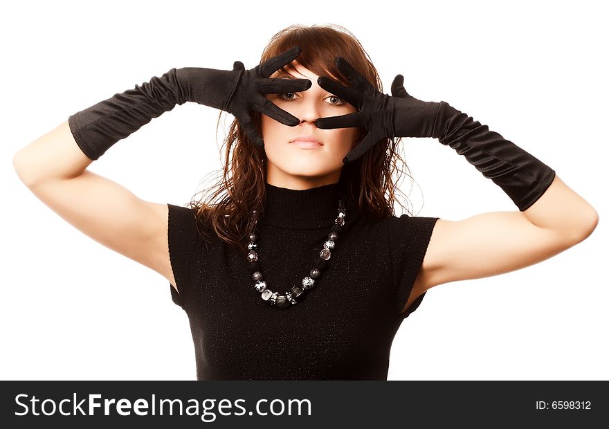 The girl in black clothes on a white background with a hat hat