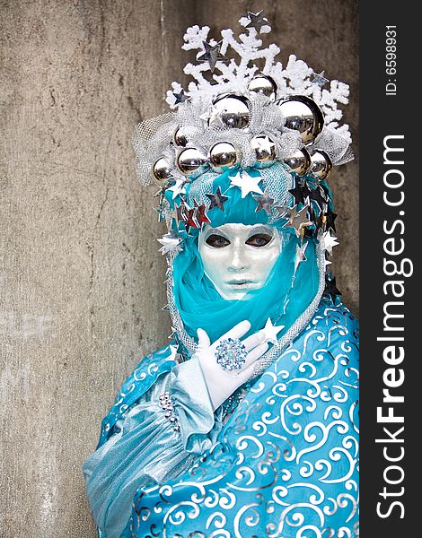 Turquoise and silver costume at the Venice Carnival. Turquoise and silver costume at the Venice Carnival