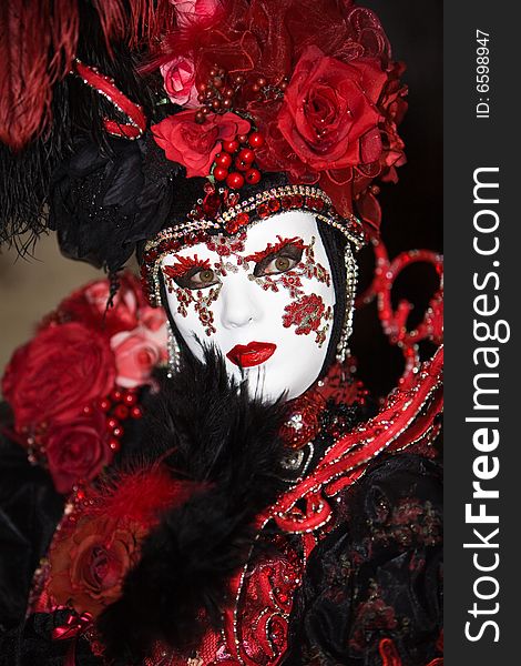 Black and red costume at the Venice Carnival. Black and red costume at the Venice Carnival