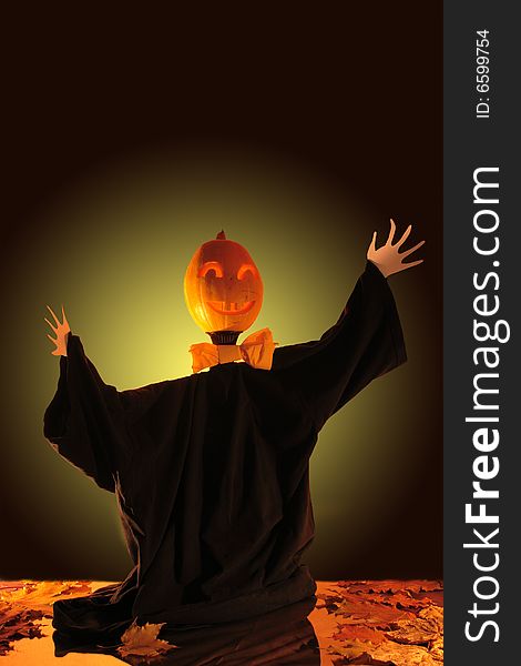 Halloween scarecrow with jack-o'-lantern head