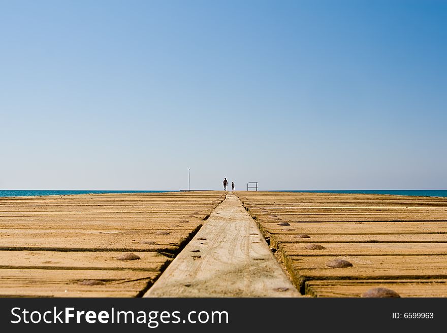 Wooden mooring on a background of the blue sky