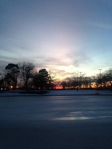 Sunset In A Park With Ice On Frozen Pond In Winter. Stock Photography