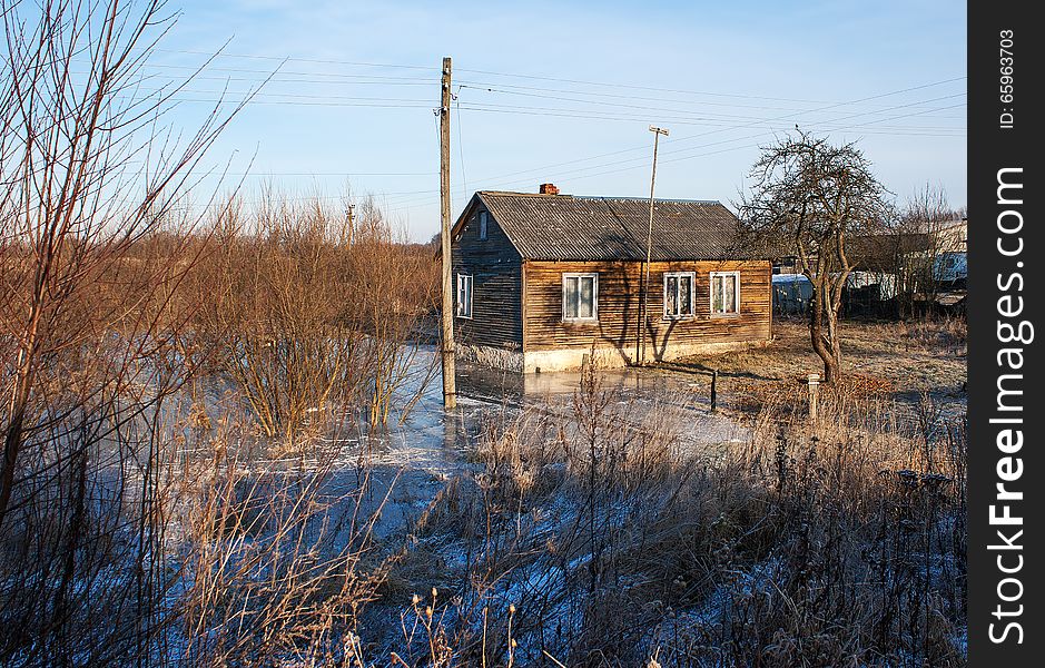 Farmhouse standing in water in winter. Farmhouse standing in water in winter