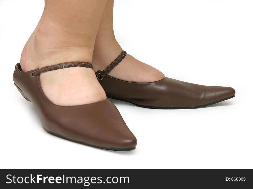 Pointy brown ladies designer shoes with white background. Pointy brown ladies designer shoes with white background