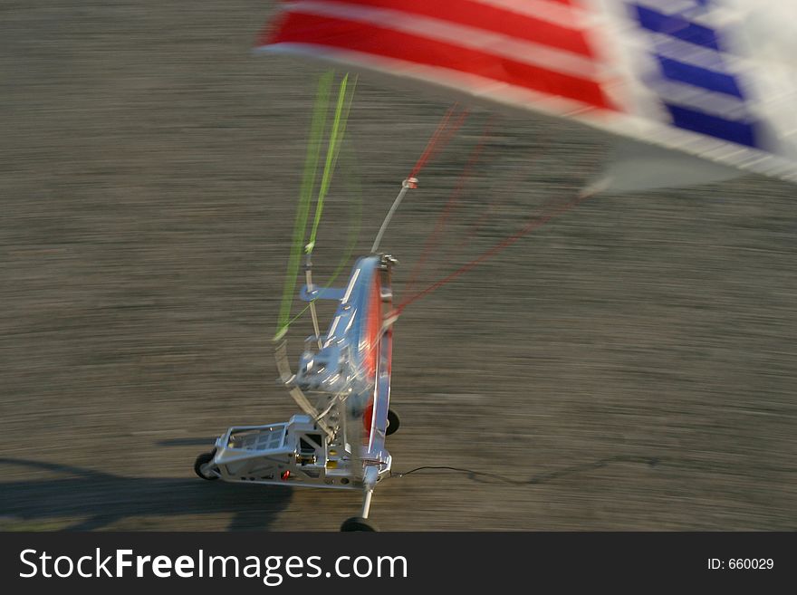 Close-up of a model paraglider landing at high speed. Close-up of a model paraglider landing at high speed.