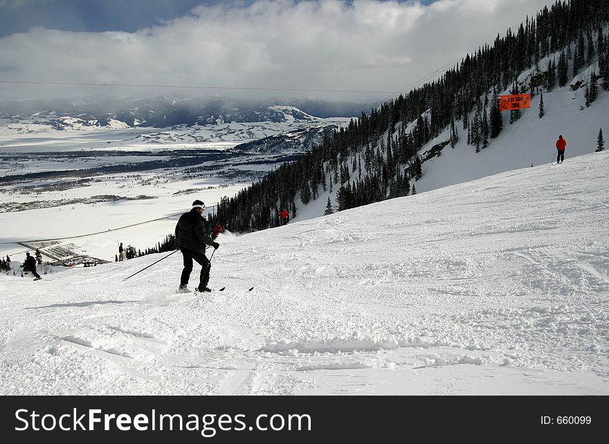 Skiing on a ski slope with various skiers about the Winter scene. Skiing on a ski slope with various skiers about the Winter scene.