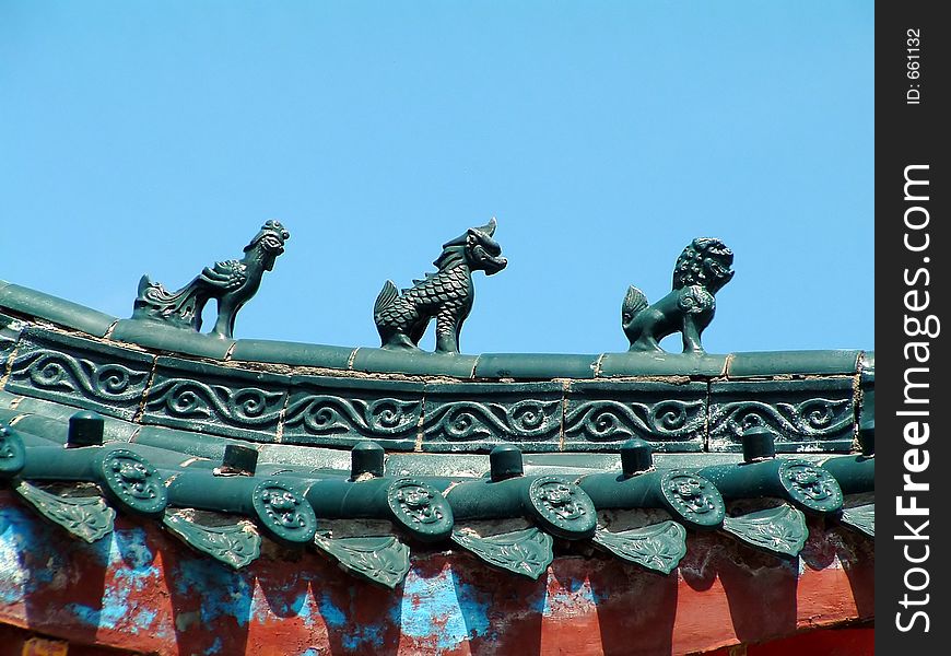 Animal sculptures on the roof of chinese Forbidden City in Beijing china