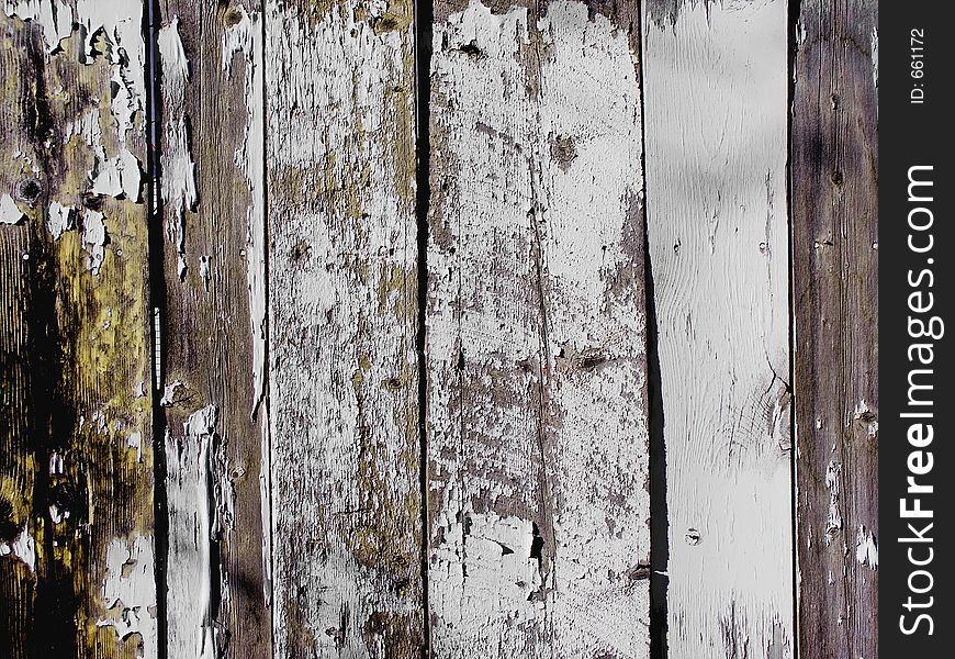 Old white fence with peeling paint