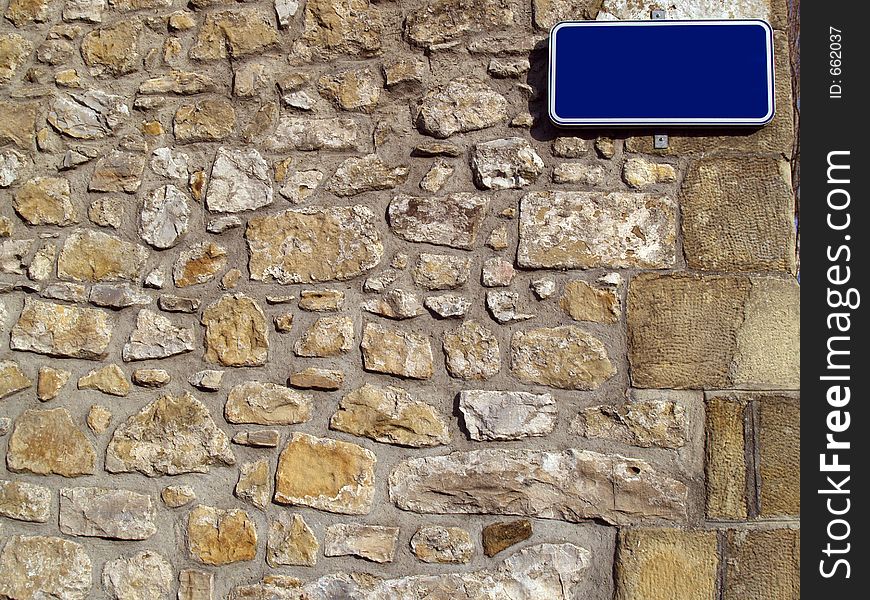 Wall with street name sign