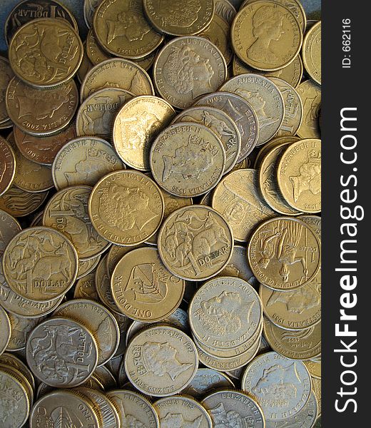 Lots of one dollar Australian coins. Lots of one dollar Australian coins.