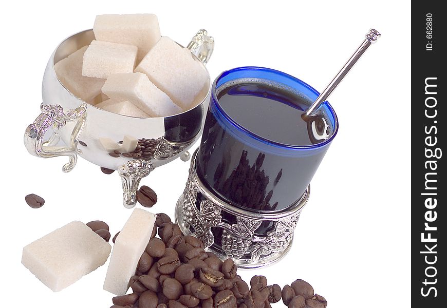 Coffee cup and refined sugar and coffee-beans. Coffee cup and refined sugar and coffee-beans