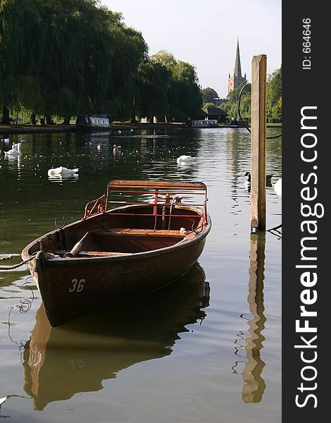 A little boat sitting on the river Avon in Stratford, England. Shakespeare was born in this town. A little boat sitting on the river Avon in Stratford, England. Shakespeare was born in this town.