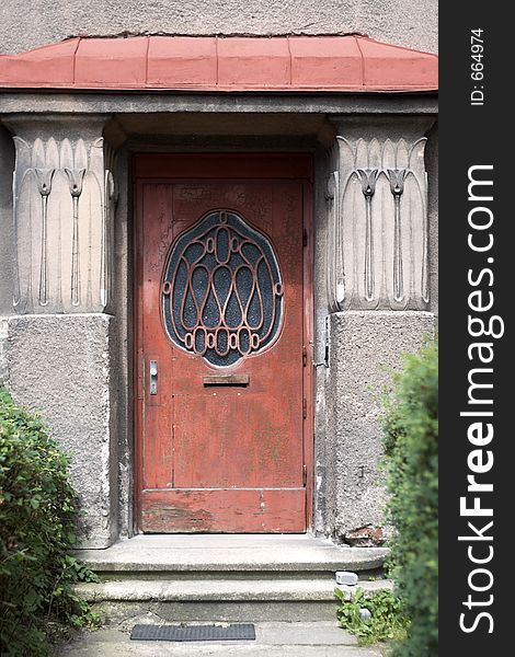 Red door, stairs and doormat