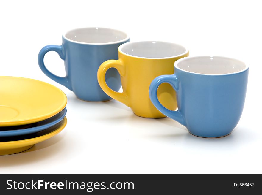 Coffee cups and dishes on white background. Coffee cups and dishes on white background