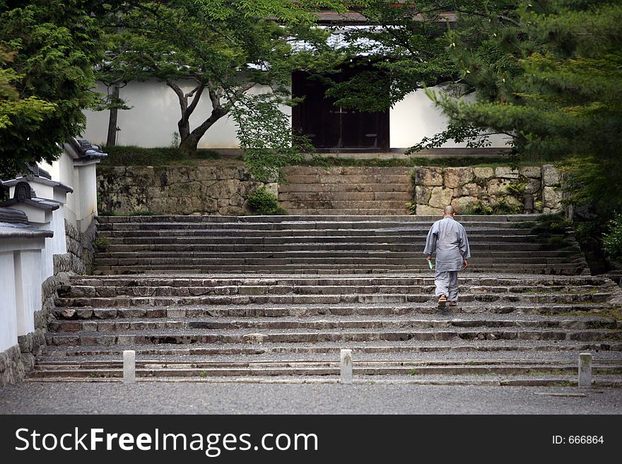 Monk at the temple entrance. Monk at the temple entrance