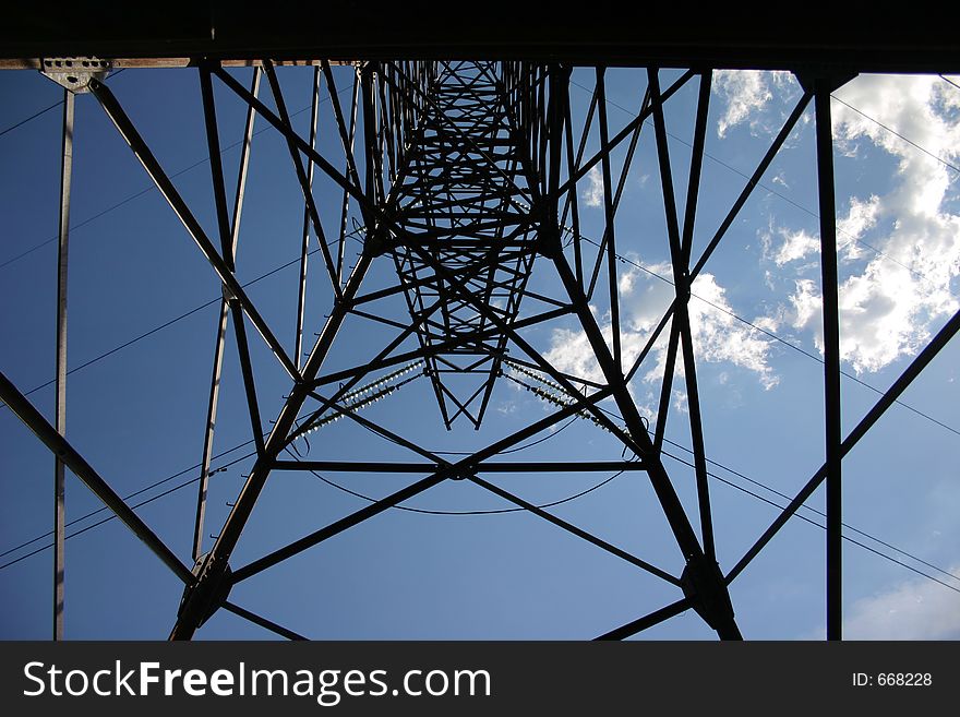 High-voltage tower against a background sky
