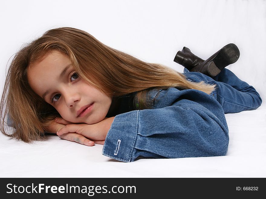 Young girl relaxing on ground