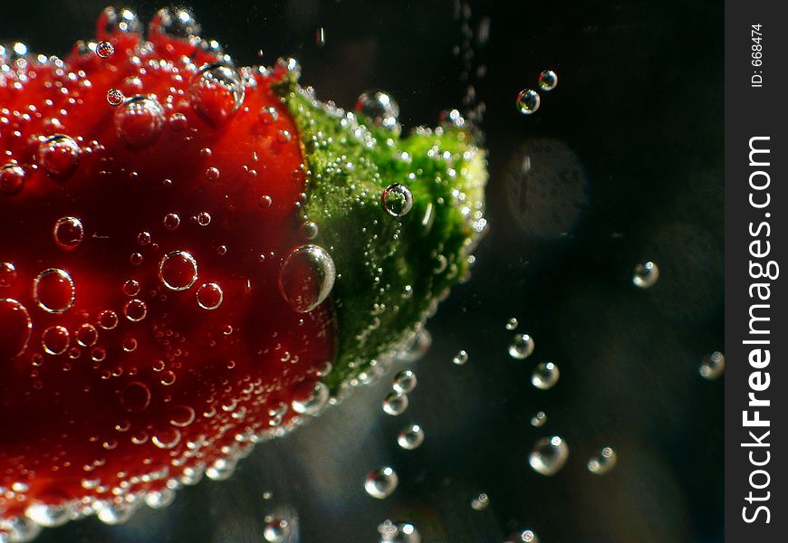 Bubbles in mineral water with pepper. Bubbles in mineral water with pepper