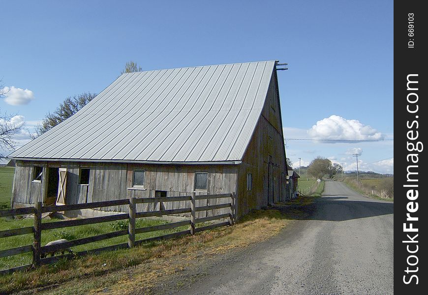Old barn on gravel road. Old barn on gravel road