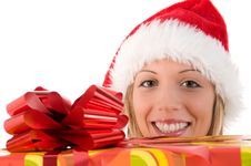 Girl With Santa S Hat And Colorful Christmas Gifts Royalty Free Stock Image