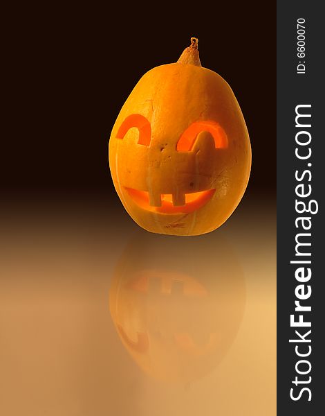 Halloween close-up of jack-o'-lantern head on dark background. Halloween close-up of jack-o'-lantern head on dark background