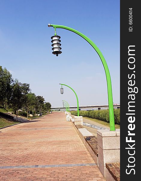 The street lamp with the blue sky background.