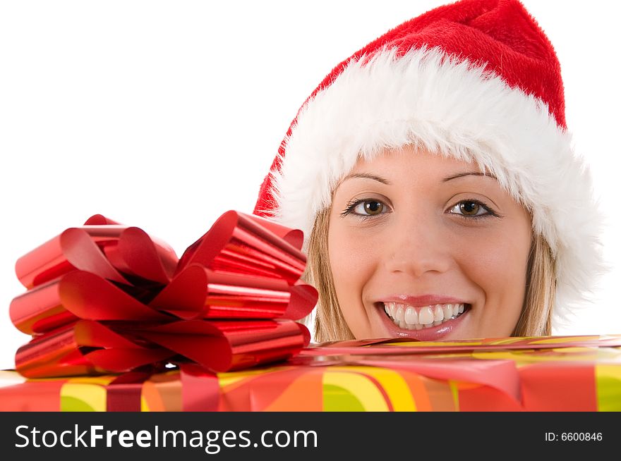Girl with Santa's hat and colorful Christmas gifts