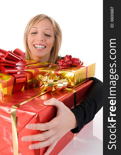 Young  smiling woman embraces Christmas gifts. Young  smiling woman embraces Christmas gifts