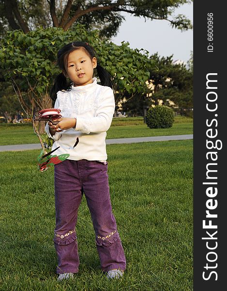 Chinese girl play kite, fly kite