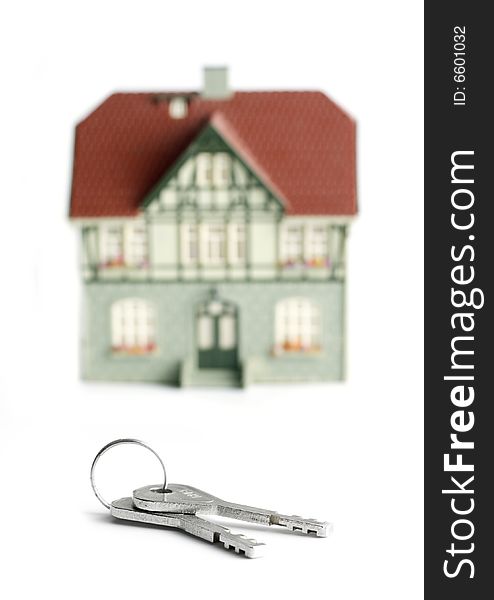 House and keys over white