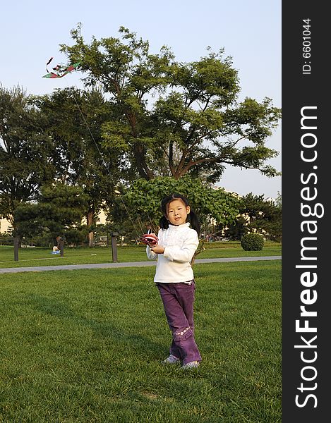 Chinese girl play kite