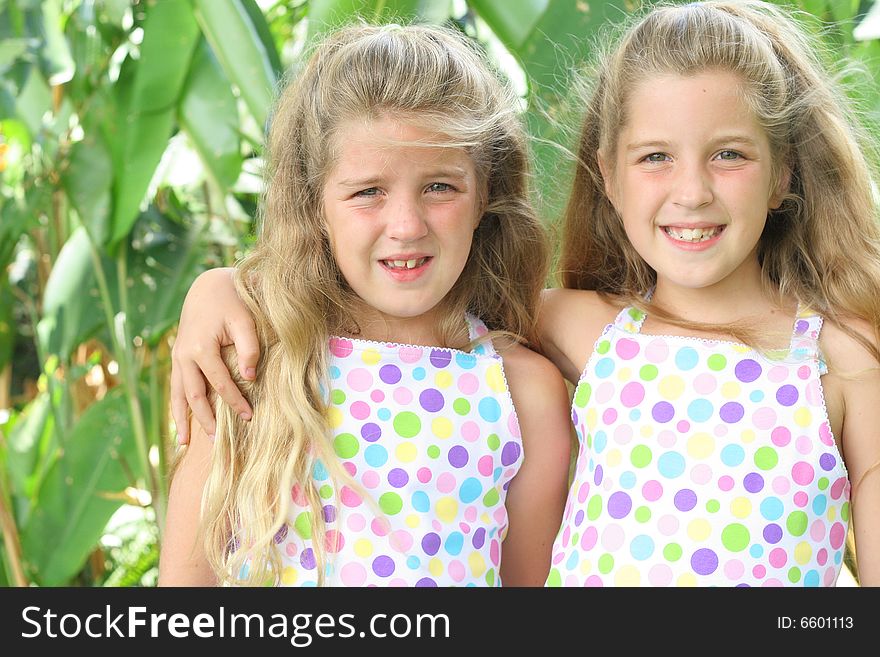 Shot of identical twin beautiful sisters