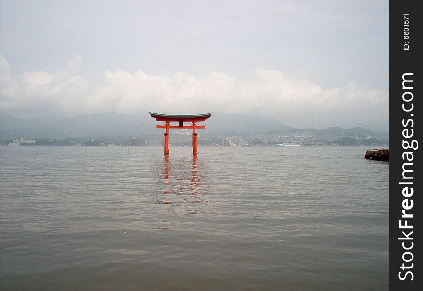 The floating gate at Miyajima in Japan.  Hiroshima can be seen in the background.